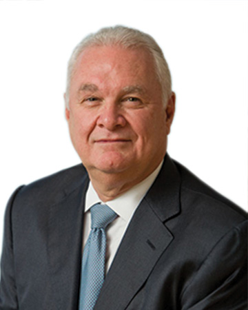 Juan N. Cento Bio a man in a suit and tie
