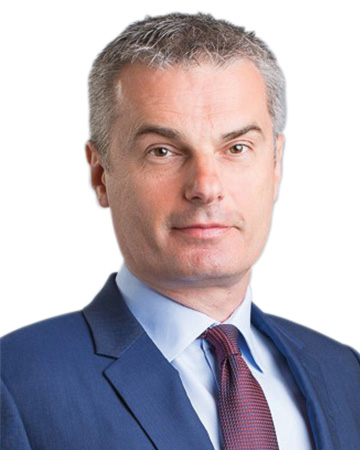 Ogi Redzic headshot a man in a suit and tie