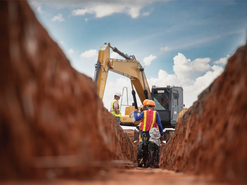 a construction worker on a motorcycle