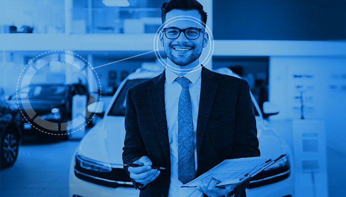 Man, smiling and standing in front of a car with a clipboard and pen Man, smiling and standing in front of a car with a clipboard and pen